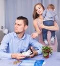 woman with crying son extorting money Royalty Free Stock Photo