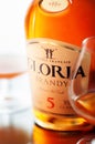 Gloria brandy bottle and two glasses Royalty Free Stock Photo