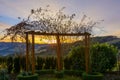 Glorious epic sunrise on a winter morning with a colorful sky looking through a rose pergola