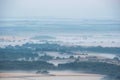 Glorious landscape image of layers of mist rolling over South Downs National Park English countryside during misty Summer sunrise Royalty Free Stock Photo