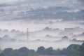 Glorious landscape image of layers of mist rolling over South Downs National Park English countryside during misty Summer sunrise Royalty Free Stock Photo