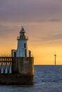 A glorious morning at Blyth beach, with a beautiful sunrise over the old wooden Pier stretching out to the North Sea Royalty Free Stock Photo