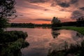 A glorious sky as the sun sets over the lake at Hardwick Park in Sedgefield, County Durham Royalty Free Stock Photo