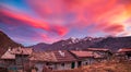 Glorious sunset in the italian Alps. Beautiful sky over snowy valley idyllic village and snowcapped mountain peaks. Winter in Royalty Free Stock Photo