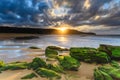 Glorious Winter Sunrise at the Seaside with Green Mossy Rocks