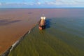 Glory Future, a bulk carrier, bulker, cargo ship, aground near the shore of the South East Asia
