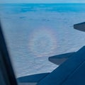 Glory optical phenomenon viewed from airplane window