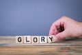 Glory. Wooden letters on the office desk Royalty Free Stock Photo