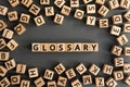 Glossary - word from wooden blocks with letters