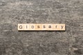 glossary word written on wood block. glossary text on table, concept Royalty Free Stock Photo