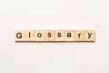 glossary word written on wood block. glossary text on table, concept Royalty Free Stock Photo