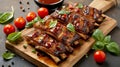 Glossy BBQ ribs with fresh basil and cherry tomatoes on bamboo cutting board. Sweet and smoky ribs with ripe cherry tomatoes and