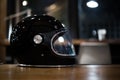 Glossy black helmet on table Royalty Free Stock Photo