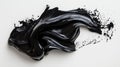 Abstract black paint smear with glossy texture and dynamic flow on white background Royalty Free Stock Photo