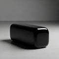 Glossy black rectangular object with rounded edges is placed on Royalty Free Stock Photo