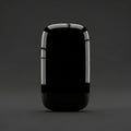 A glossy, black, rectangular object with rounded edges stands upright aga Royalty Free Stock Photo
