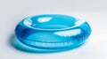 A glossy blue inflatable swimming ring on a white background, highlighting leisure and summertime