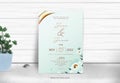 Glossy Floral Wedding Invitation Card And Plant Pot On Gray Wooden