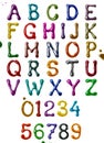 Glossy letters of the Latin alphabet and numbers made of colorful glaze Royalty Free Stock Photo