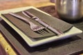 Glossy Metal Fork And Knive On a Black Napkin