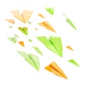 Glossy orange and green paper airplanes isolated