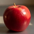 A glossy red apple with a smooth surface and subtle speckles Royalty Free Stock Photo