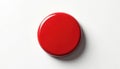 Glossy red round button sits on white surface. Simple isolated object. Graphic element, interface control. Ready for action, Royalty Free Stock Photo