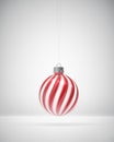 Glossy red and white twisted striped Christmas ball