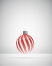 Glossy red and white twisted striped Christmas bauble