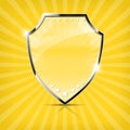 Glossy security shield on yellow background