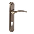 Glossy, spiral, bronze-colored door handle with perforations for the hands on the upper surface