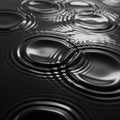 Glossy surface with smooth, concentric ripples creating circular patterns. The reflecti Royalty Free Stock Photo