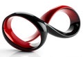A glossy, three-dimensional infinity symbol features two intertwined loops. Royalty Free Stock Photo
