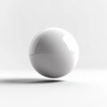 Glossy white sphere on clean, minimalistic background casting sharp shadow