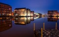 Gloucester docks on sharpness canal. Warehouse apartments reflected in quay water Royalty Free Stock Photo