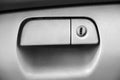 Glove box in the car. Keyhole of a closed car glove box- Image