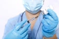 A gloved doctor fills a syringe with a virus vaccine Royalty Free Stock Photo