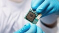 Gloved hand carefully holding computer microchip Royalty Free Stock Photo