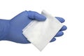 Gloved hand holding an antibacteria cleansing wipe