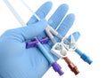 Gloved hand holding a catheter and introducer Royalty Free Stock Photo