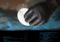 Gloved hand holding a CD in front of cloudy background Royalty Free Stock Photo