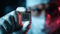 gloved hand holding microchip technology Royalty Free Stock Photo