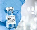 Small drug vial with influenza vaccine Royalty Free Stock Photo