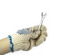 Gloved hand holding a wrench Royalty Free Stock Photo