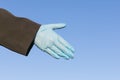 gloved hand in position for handshake