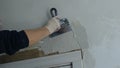 Right hand plasterer with working tool