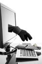 Gloved hand stealing wallet through a computer screen Royalty Free Stock Photo