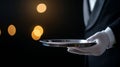 Waiter holding empty tray in elegant restaurant setting Royalty Free Stock Photo