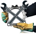 Gloved Hands Holding a Metal Cog with Two Steel Adjustable Wrenches Royalty Free Stock Photo