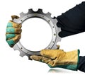 Gloved Hands Holding a Metallic Cogwheel with Copy Space